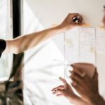 person holding white printer paper