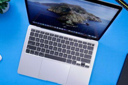 macbook pro on blue table
