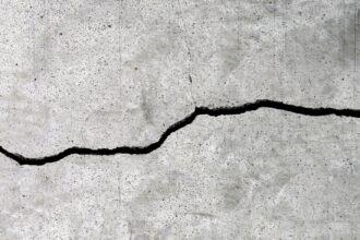 Cracked cement floor texture for background.