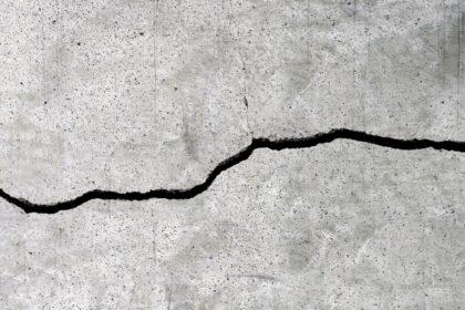 Cracked cement floor texture for background.