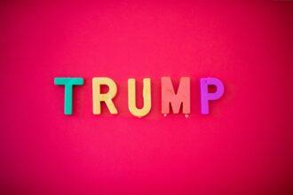 The word TRUMP isolated against red background shot from directly above