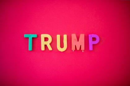 The word TRUMP isolated against red background shot from directly above